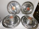 Four Vintage 1960s Buick 14 Spinner Hubcaps